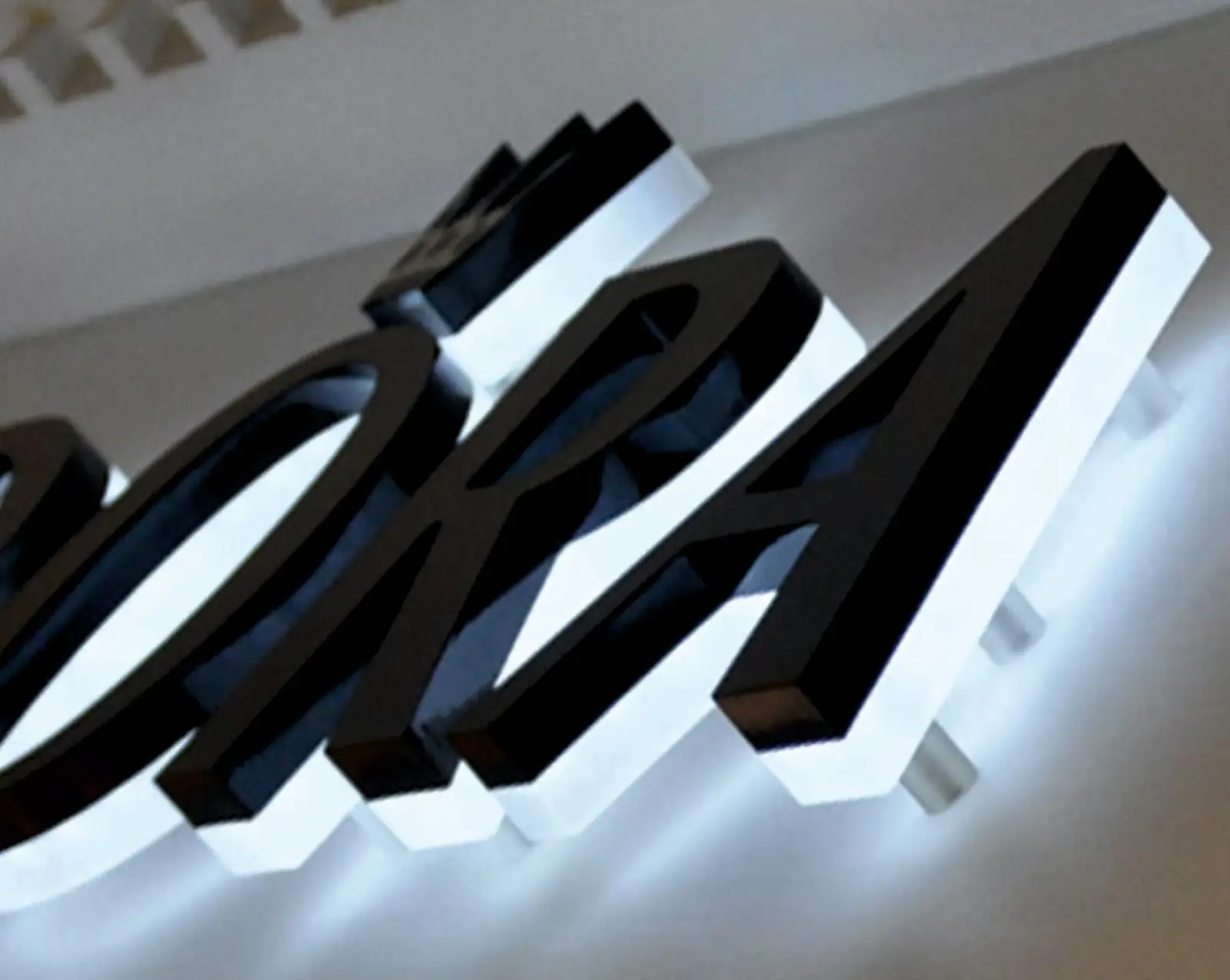 Halo-lit built-up letters glowing at night
