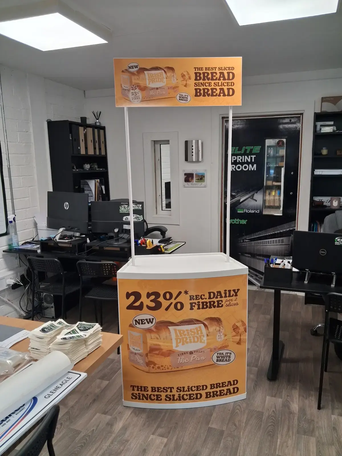 Elite Signs print room with a printed point-of-sale display